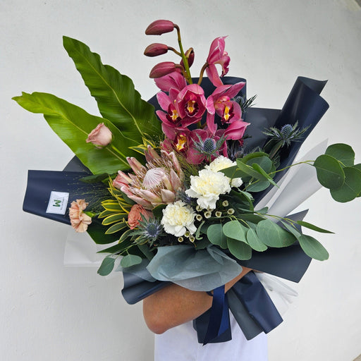 Regal Beauty - Protea King and Cymbidium Hand Bouquet - Flower Bouquet - Flower Delivery Singapore - Well Live Florist