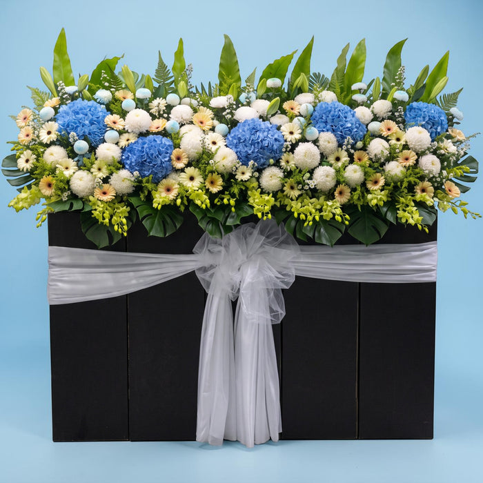 Boundless Grace condolence flower stand, blue and white sympathy flowers Singapore