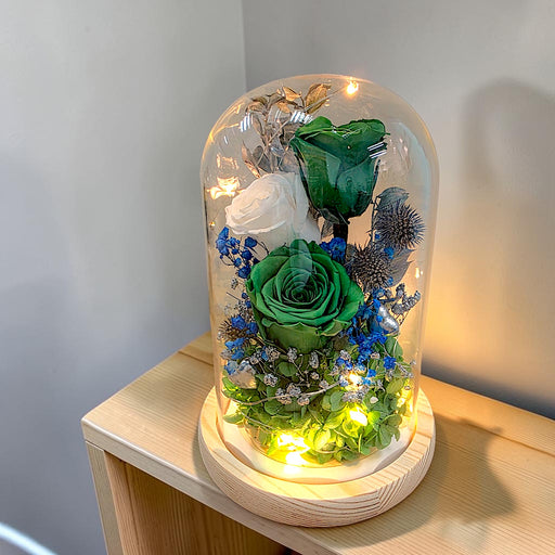 Emerald Enchantment preserved rose dome with fairy lights on wooden base