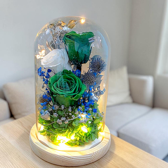 Close-up of preserved emerald green roses inside glass dome Singapore