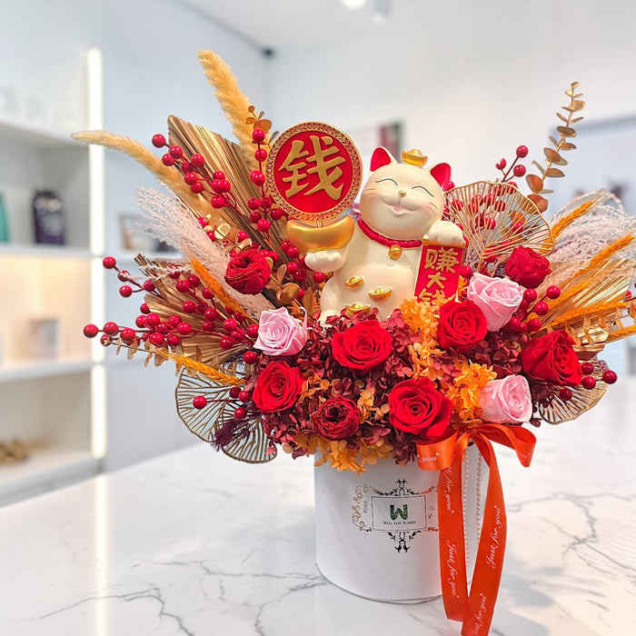 Golden Fortune Cat preserved flower box styled by window with red roses, pampas grass and gold fan accents