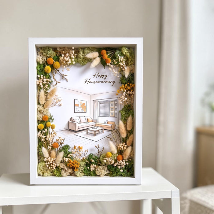 Housewarming gift set from Well Live Florist featuring a preserved flower frame in a premium gift box.