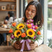 Gift-ready Sunflower Tango Basket with sunflowers, orange roses, and orchids – perfect fresh flower arrangement for birthdays and just because moments.