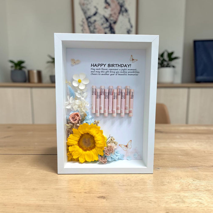 Close-up of Sunshine Fortune Frame money gift shadow box with Happy Birthday message on dining table
