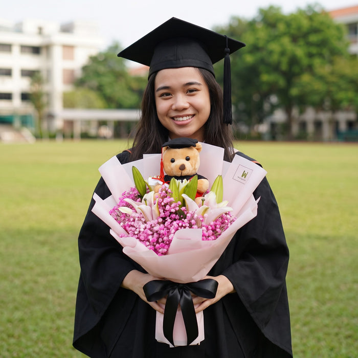 Tassel Time pink lily graduation bouquet with bear