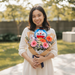 Hand-wrapped Turn the Tassel graduation bouquet with Doraemon bear, fresh from Singapore florist, ready for same-day delivery.