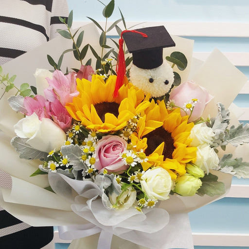 Elegant graduation bouquet with white roses and sunflowers