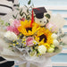 Elegant graduation bouquet with white roses and sunflowers