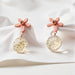 Dried Dandelion Stud Earrings. A delicate add-on to your flower bouquet. Perfect gift from Well Live Florist, Singapore.