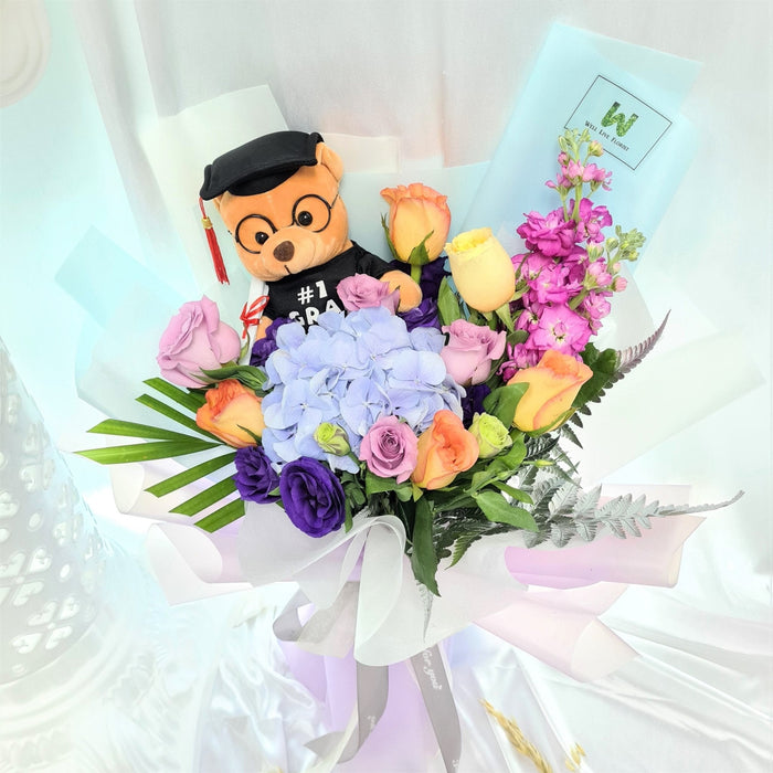 Honor Roll blue hydrangea and rose graduation bouquet with bear
