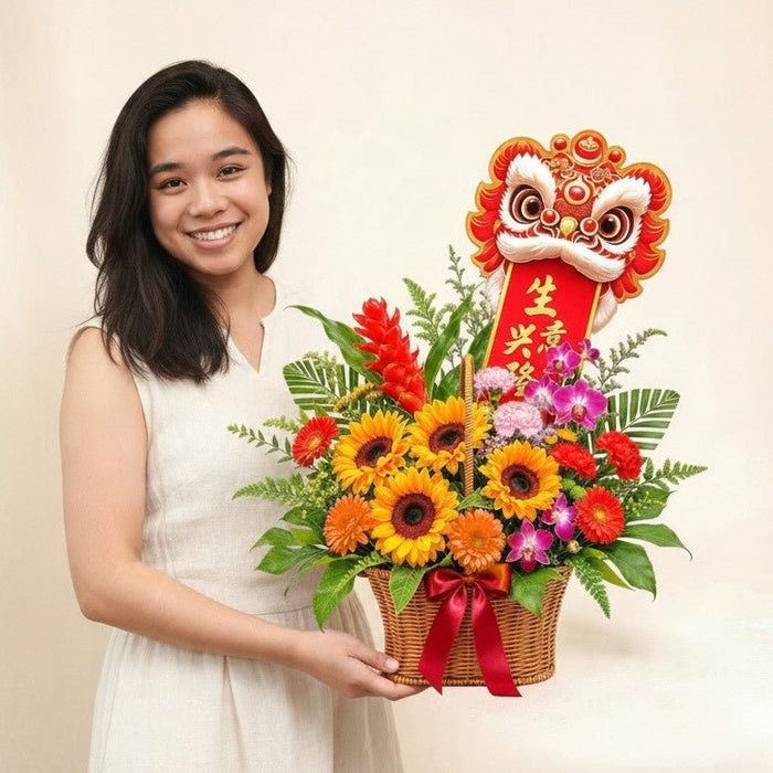 Woman holding Roaring Fortune Basket, a fresh flower basket for grand openings in Singapore