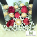 Well Live Florist Finley flower box with red roses, baby's breath, and Ferrero Rocher chocolates in a black carrier.