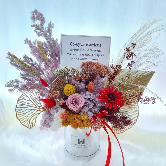 Well Live Florist preserved flower bloom box with pink rose, red daisy, and dried foliage for grand opening gifts.