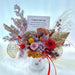 Well Live Florist preserved flower bloom box with pink rose, red daisy, and dried foliage for grand opening gifts.