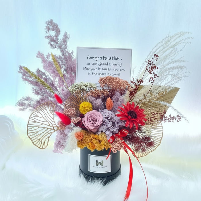 Well Live Florist preserved flower bloom box with roses, hydrangea, and foliage for a grand opening celebration.