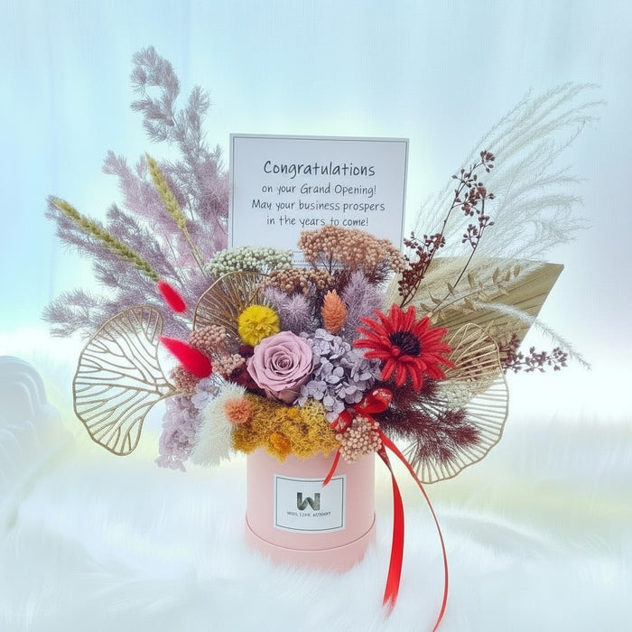 Well Live Florist grand opening preserved flower bloom box with roses, hydrangea, and foliage in a pink gift box.