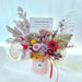 Well Live Florist grand opening preserved flower bloom box with roses, hydrangea, and foliage in a pink gift box.