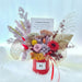 Well Live Florist grand opening preserved flower box with roses, hydrangea, and dried foliage in a red gift box.