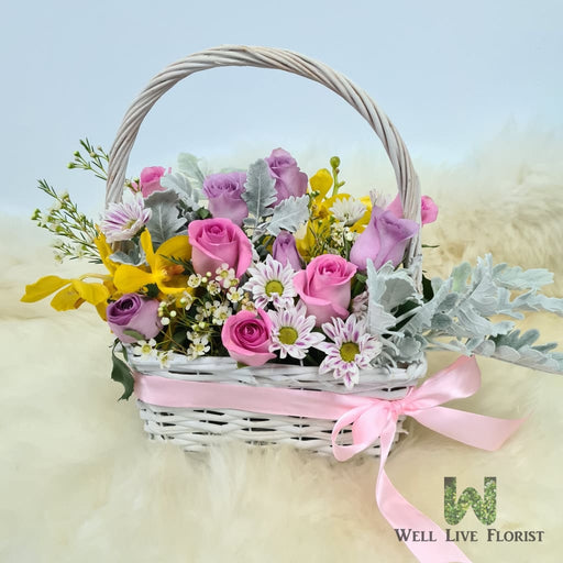 Flower Box Comprising of Roses , Orchid , Wax Flower , Pom Pom and Foliage