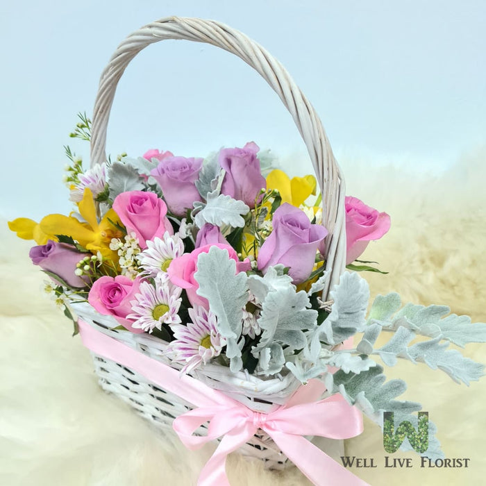 Flower Box Comprising of Roses , Orchid , Wax Flower , Pom Pom and Foliage
