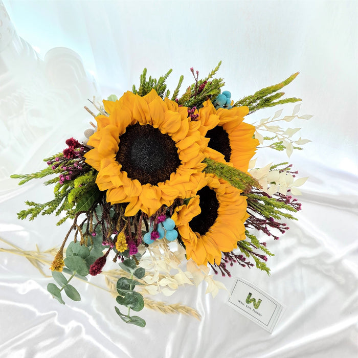Graceful hand bouquet of sunflower, filler and foliage