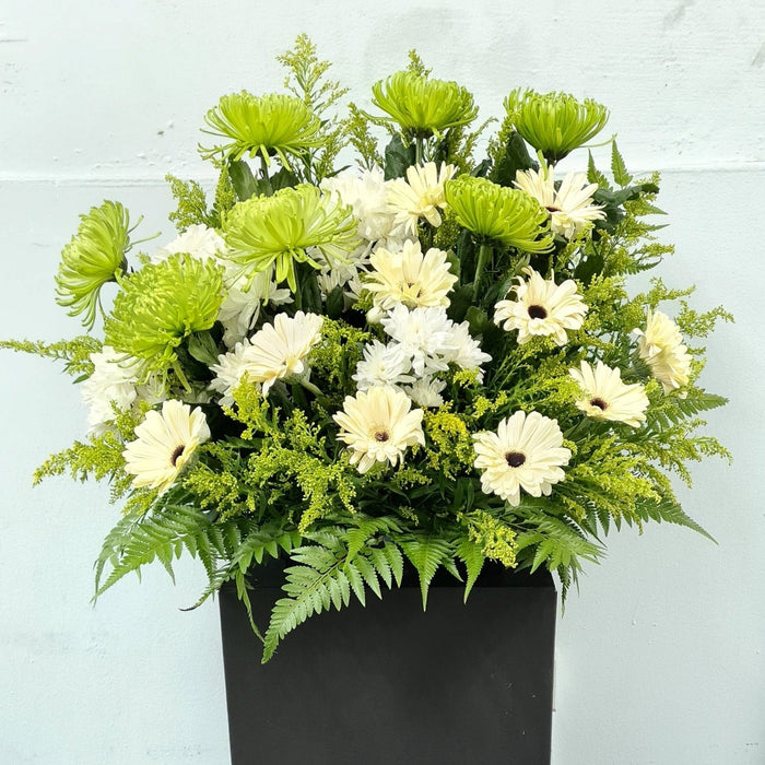 Featuring freshly-cut flowers, this thoughtful flower stand is the perfect way to pay your respects.
