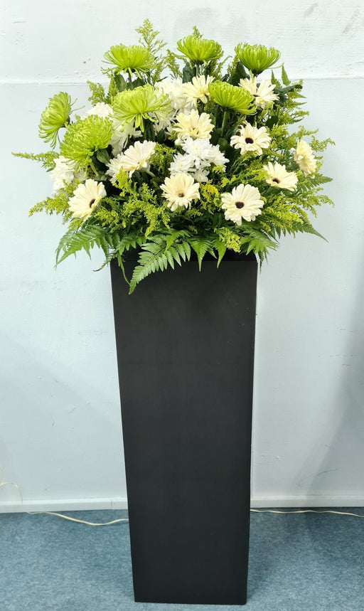 Featuring freshly-cut flowers, this thoughtful flower stand is the perfect way to pay your respects.