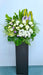 This stunning flower stand is a beautiful floral tribute that thoughtfully expresses your condolences.