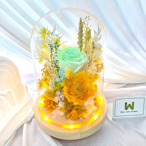 Preserved green roses, hydrangea, sunflower and dried foliage LED light included.