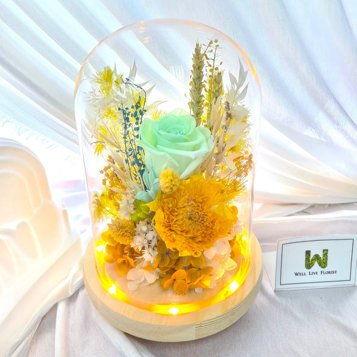 Preserved green roses, hydrangea, sunflower and dried foliage LED light included.