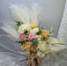 Captivating bridal bouquet of charming roses, peony, anthurium, astilbe, carnation, lunaria and foliage.