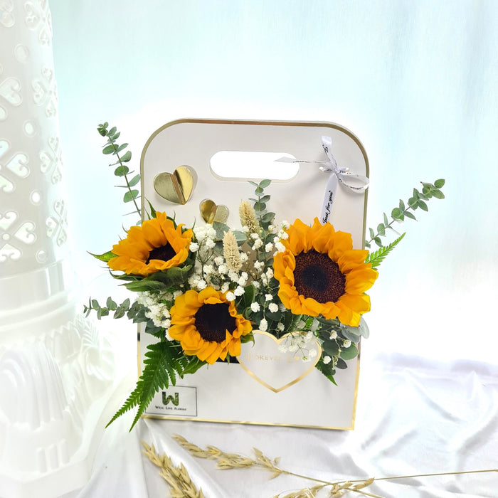 Ravishing flower box of magnificent sunflower, baby's breath and foliage.
