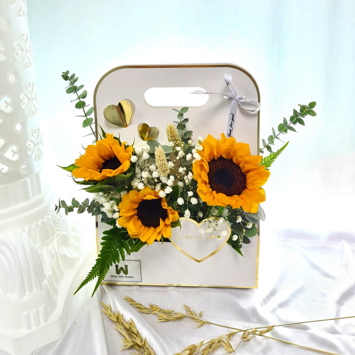 Ravishing flower box of magnificent sunflower, baby's breath and foliage.