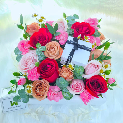 flower box of irresistible fresh roses, carnation, daisy and foliage.