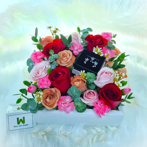 flower box of irresistible fresh roses, carnation, daisy and foliage.