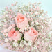 Gorgeous hand bouquet of 3 beautiful roses and baby's breath.