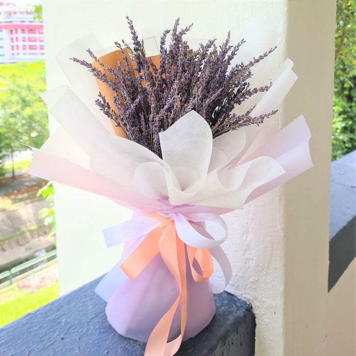 rresistible hand bouquet of elegant fresh lavender.