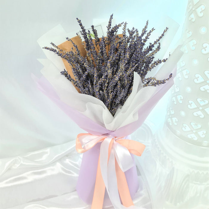 rresistible hand bouquet of elegant fresh lavender.