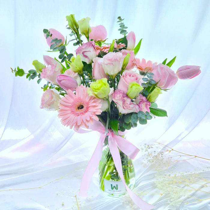 Comes with pink roses, tulips, gerbera, eustoma and foliage