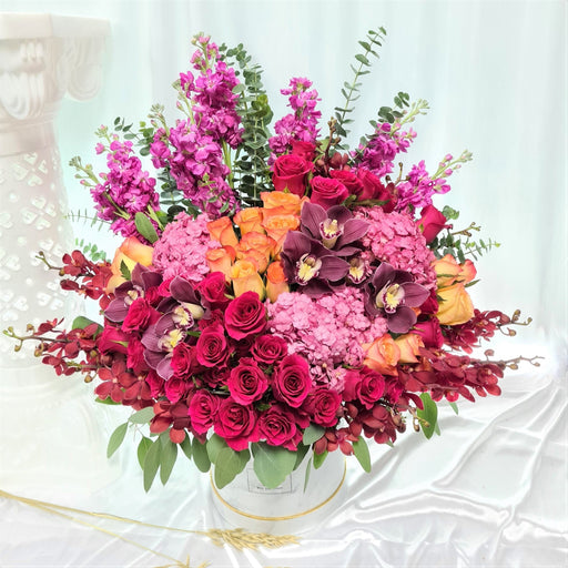 Classy flower box of stunning fresh roses, orchid, matthiolas, hydrangeas, cymbidiums and eucalyptus leaves