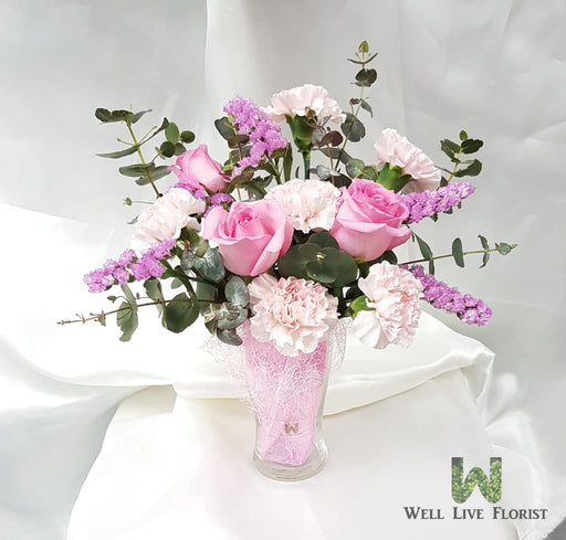 Table Arrangements of Fresh Cut Roses, Carnation and Dried Foliage In Clear Glass Ware