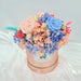 Captivating combination of preserved roses, hydrangeas, and dried foliage