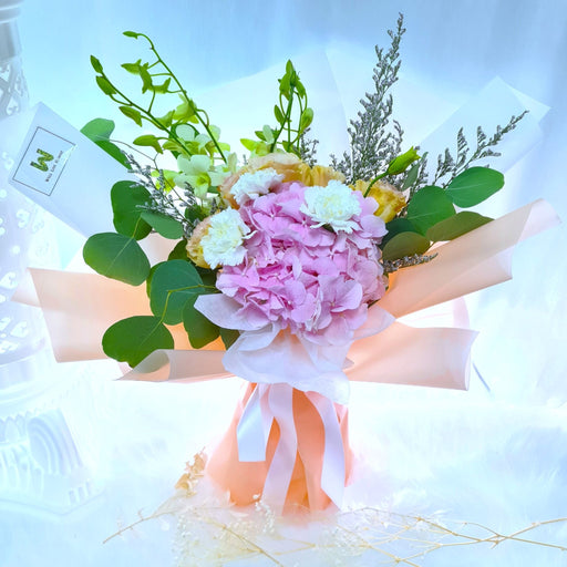 Comes with white orchid, champagne eustoma, pink hydrangea, white carnation and foliage
