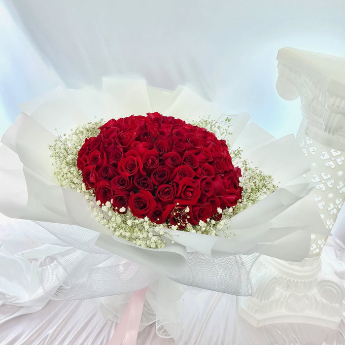 Express your love with this alluring 99 roses hand bouquet.