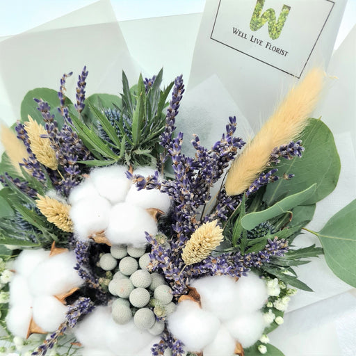 hand bouquet of elegant fresh lavender, cotton, baby's breath and foliage